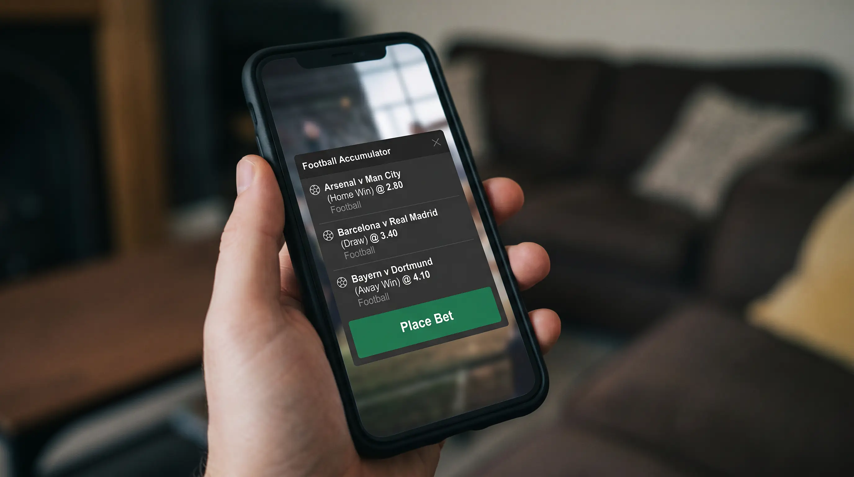 Close-up of a bet slip overlay on a football betting app with three accumulator selections