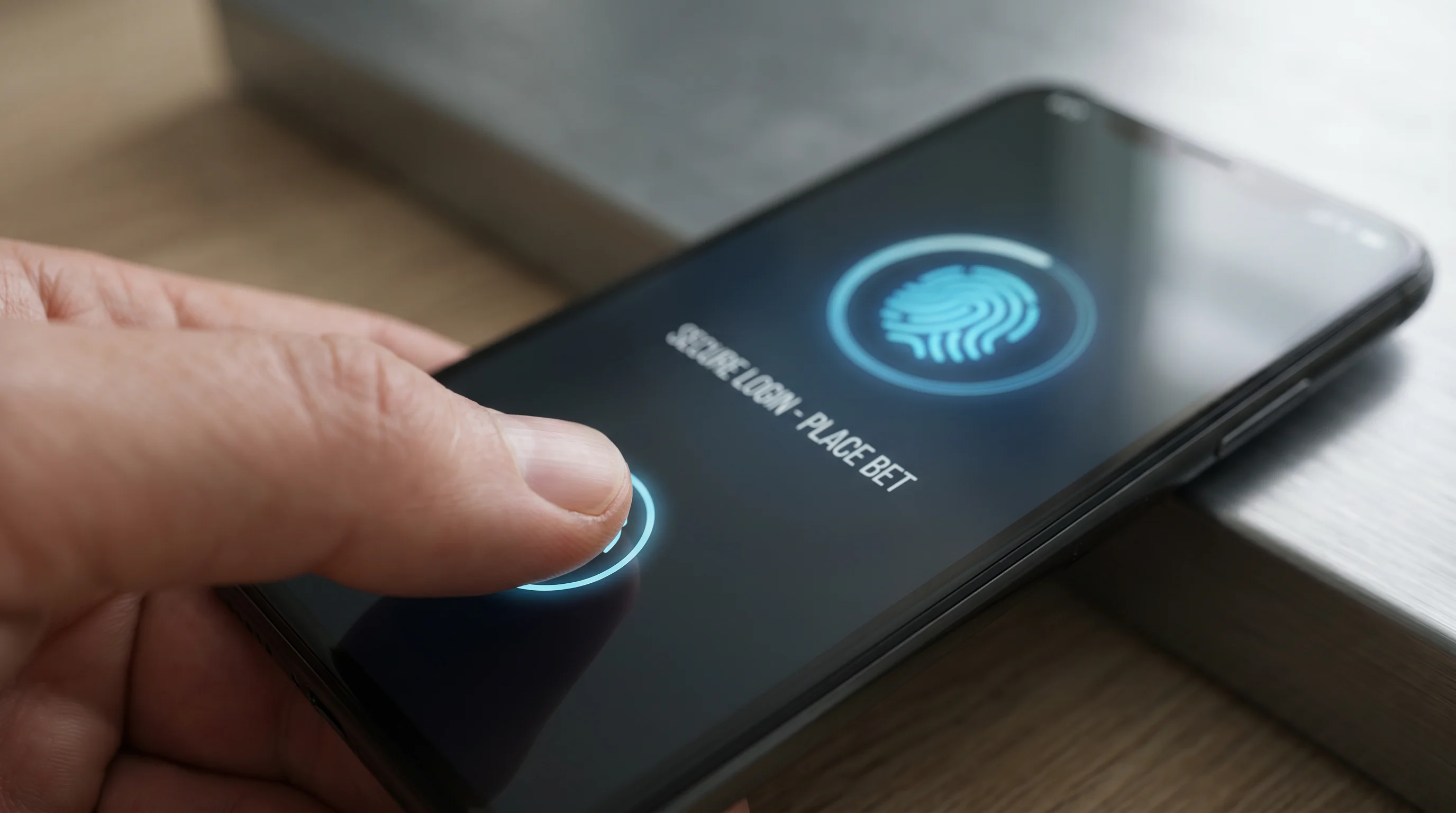 Punter using fingerprint login on a football betting app for secure account access